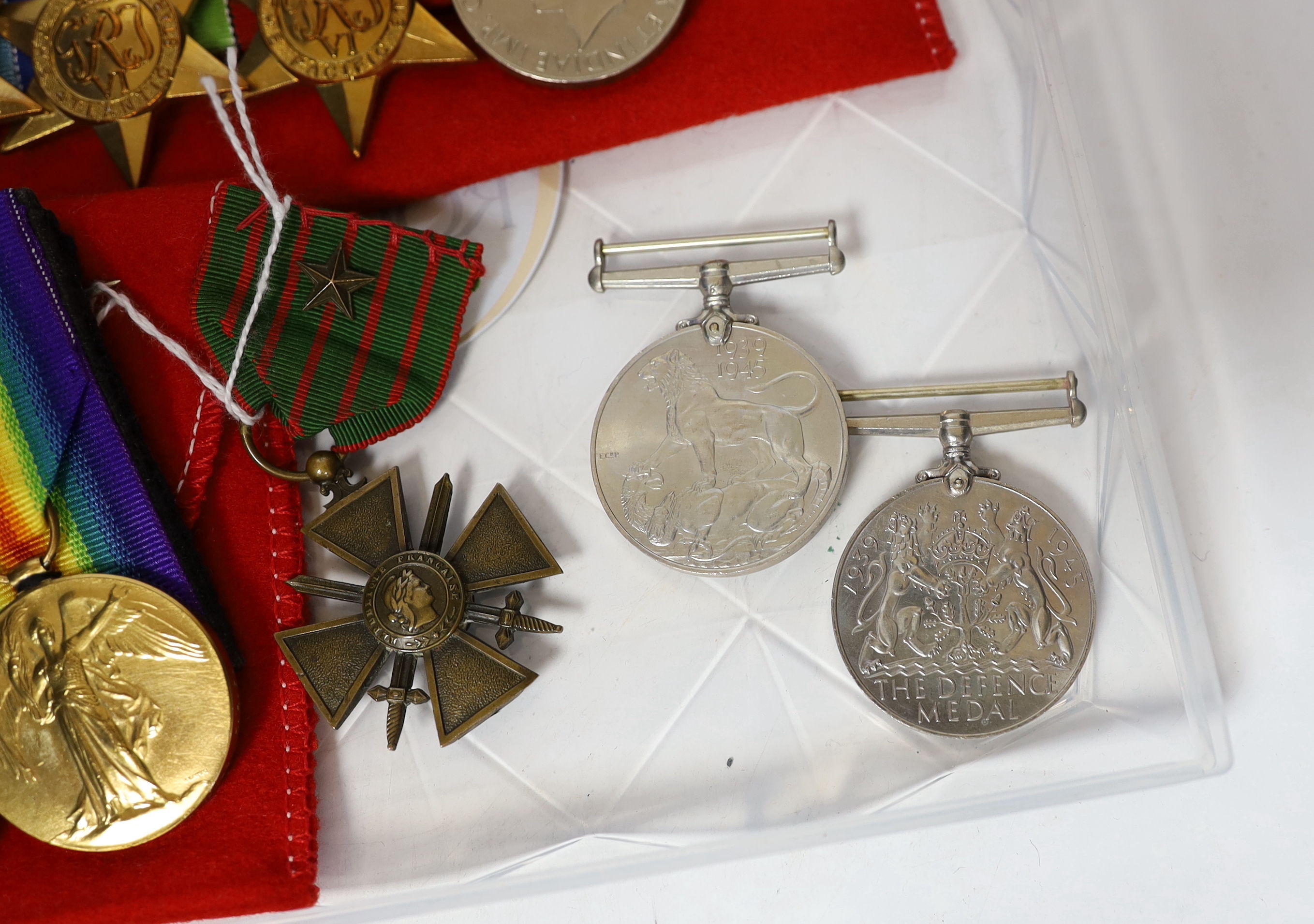 Nine WWI / WWII medals; a pair of WWI medals, the War medal and Victory medal to J.R. Hemmings R.A.F., a pair of WWII medals in O.H.M.S. card box to J.B. Robinson, with oak leaf, a group comprising; the 1939-45 Star, the